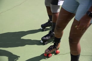 a group of people riding roller skates on a tennis court