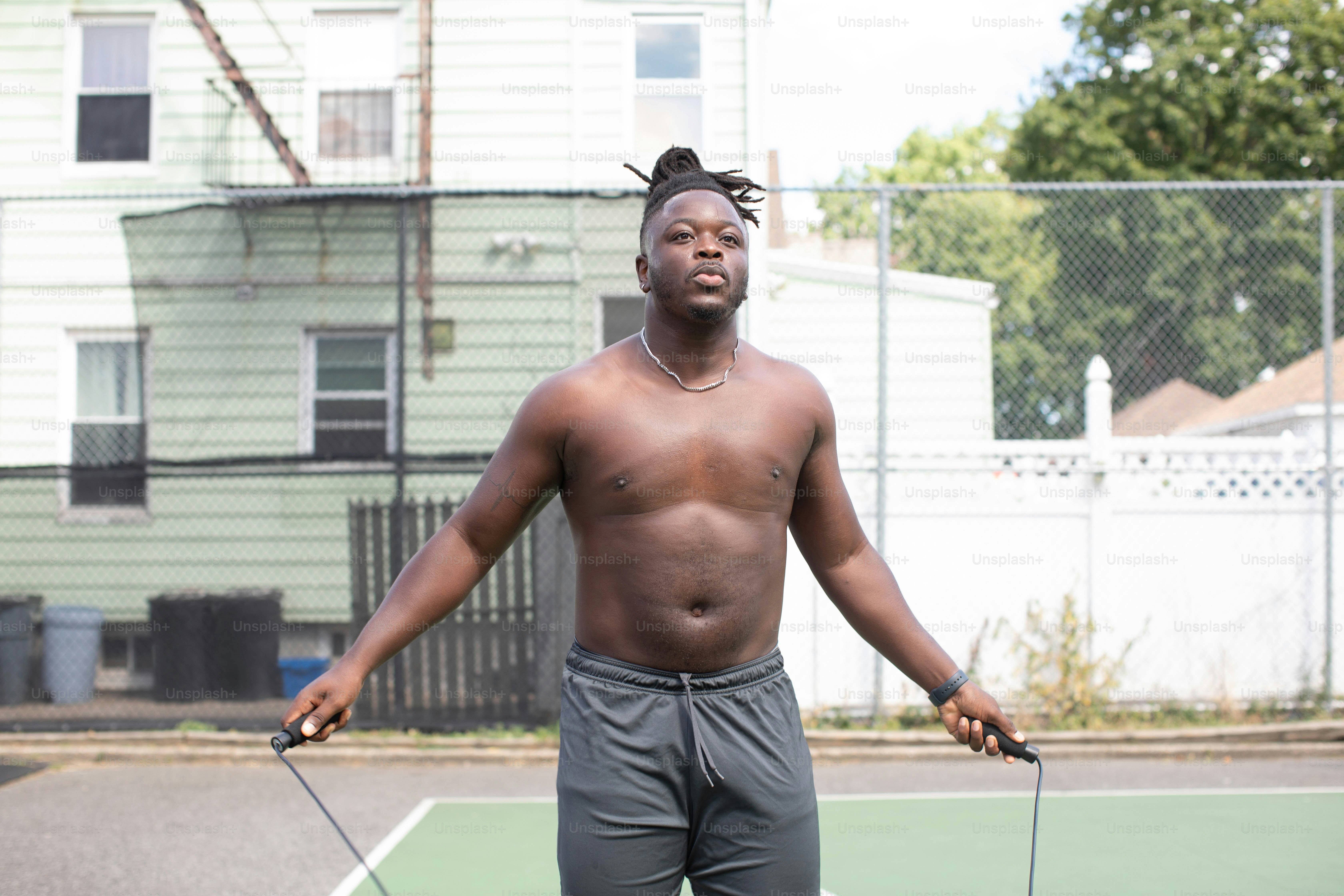 a man holding a tennis racquet on top of a tennis court