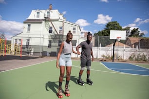 a man and a woman rollerblading on a court