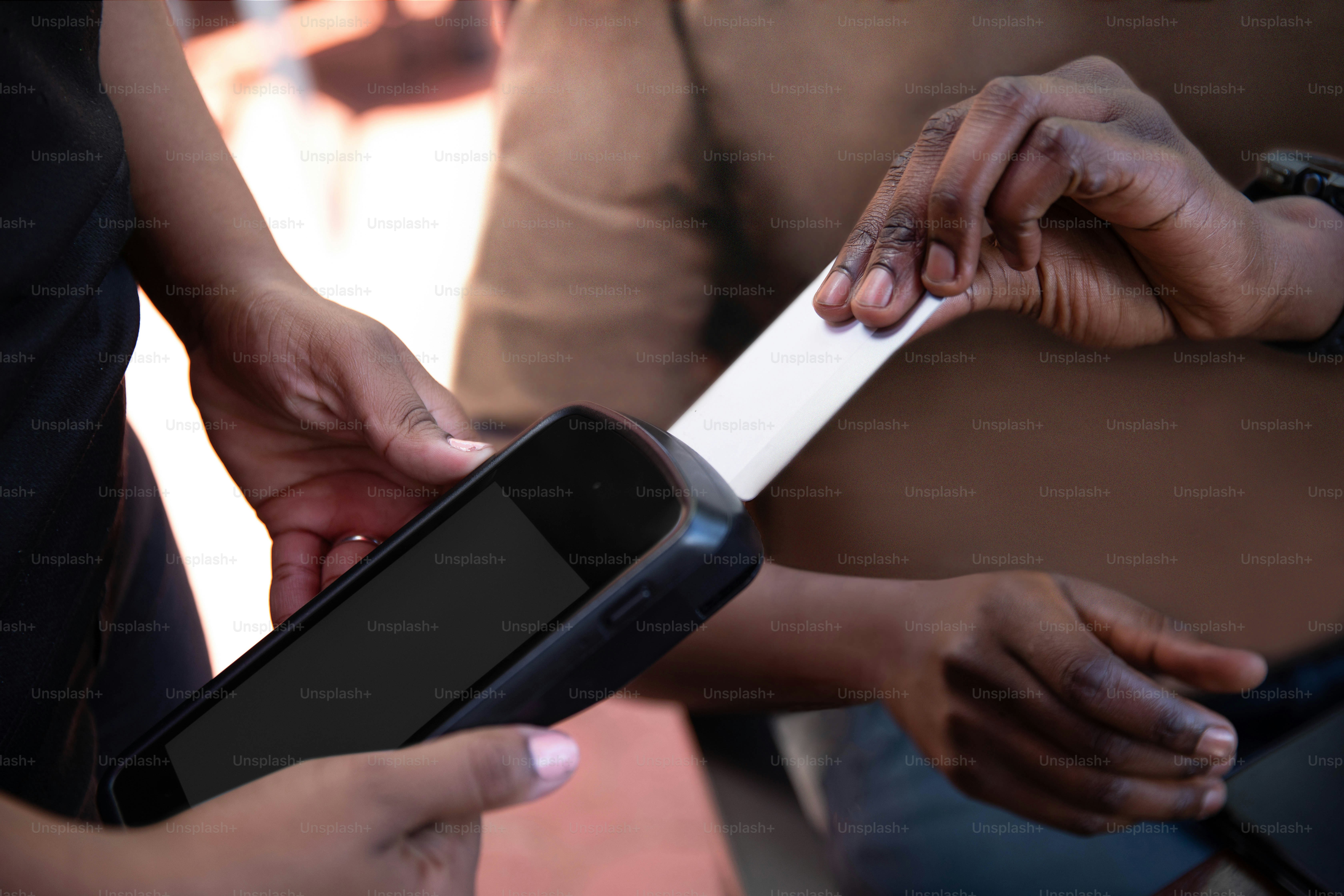 a person holding a smart phone in their hands