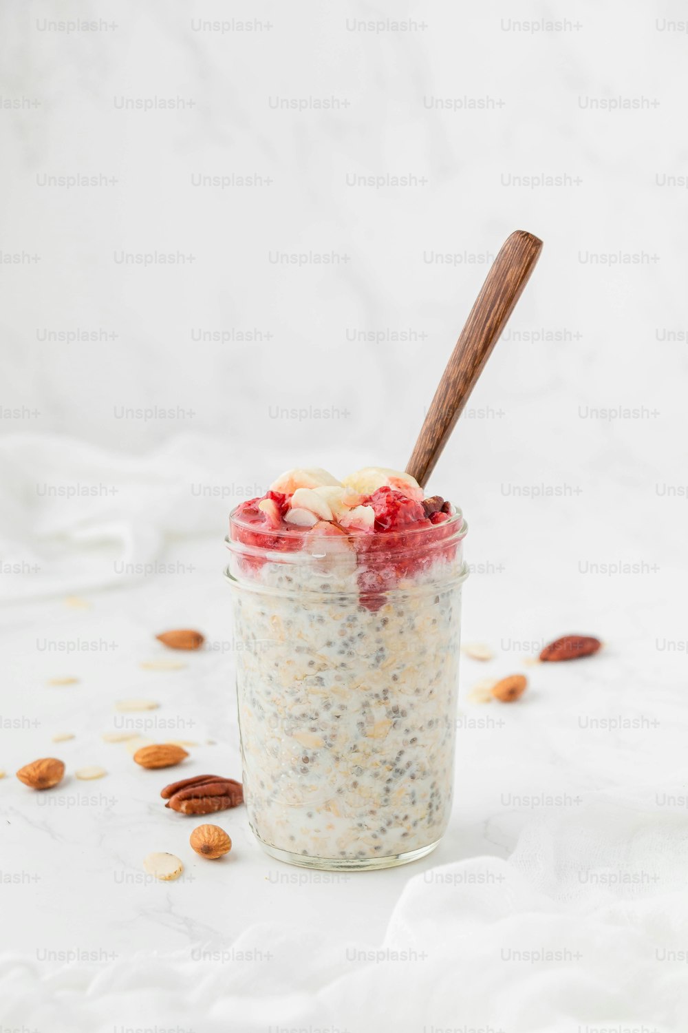 a jar of oatmeal with a spoon in it