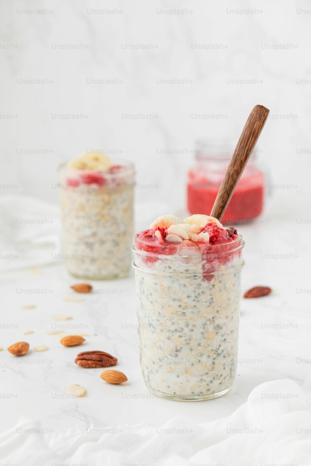 two jars filled with oatmeal and fruit
