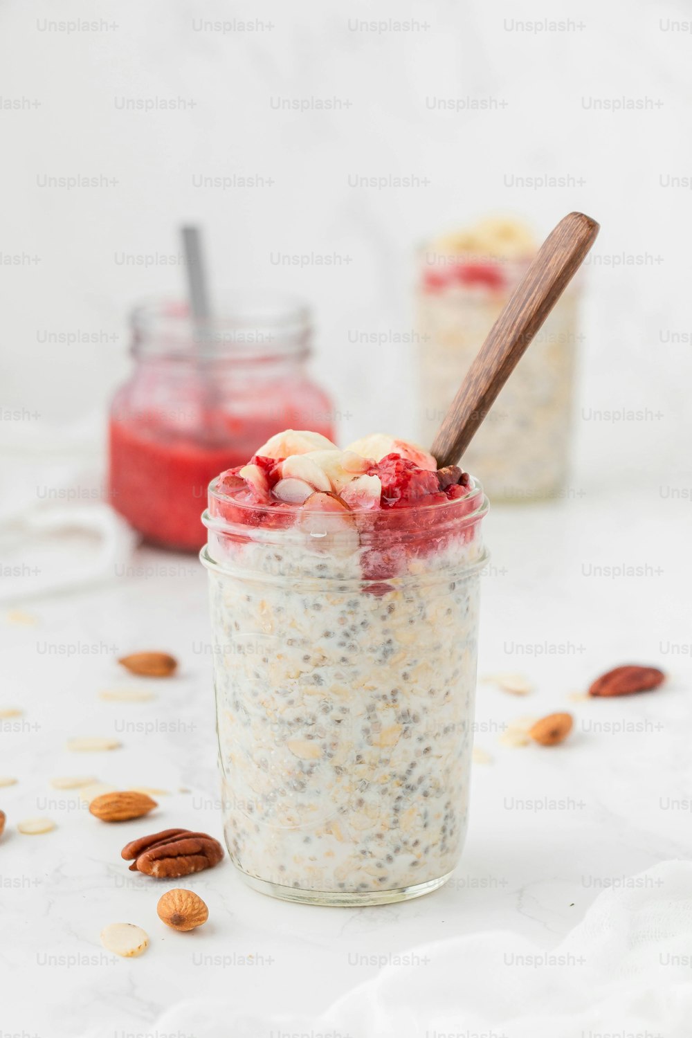 a jar of chia seed pudding with a spoon in it