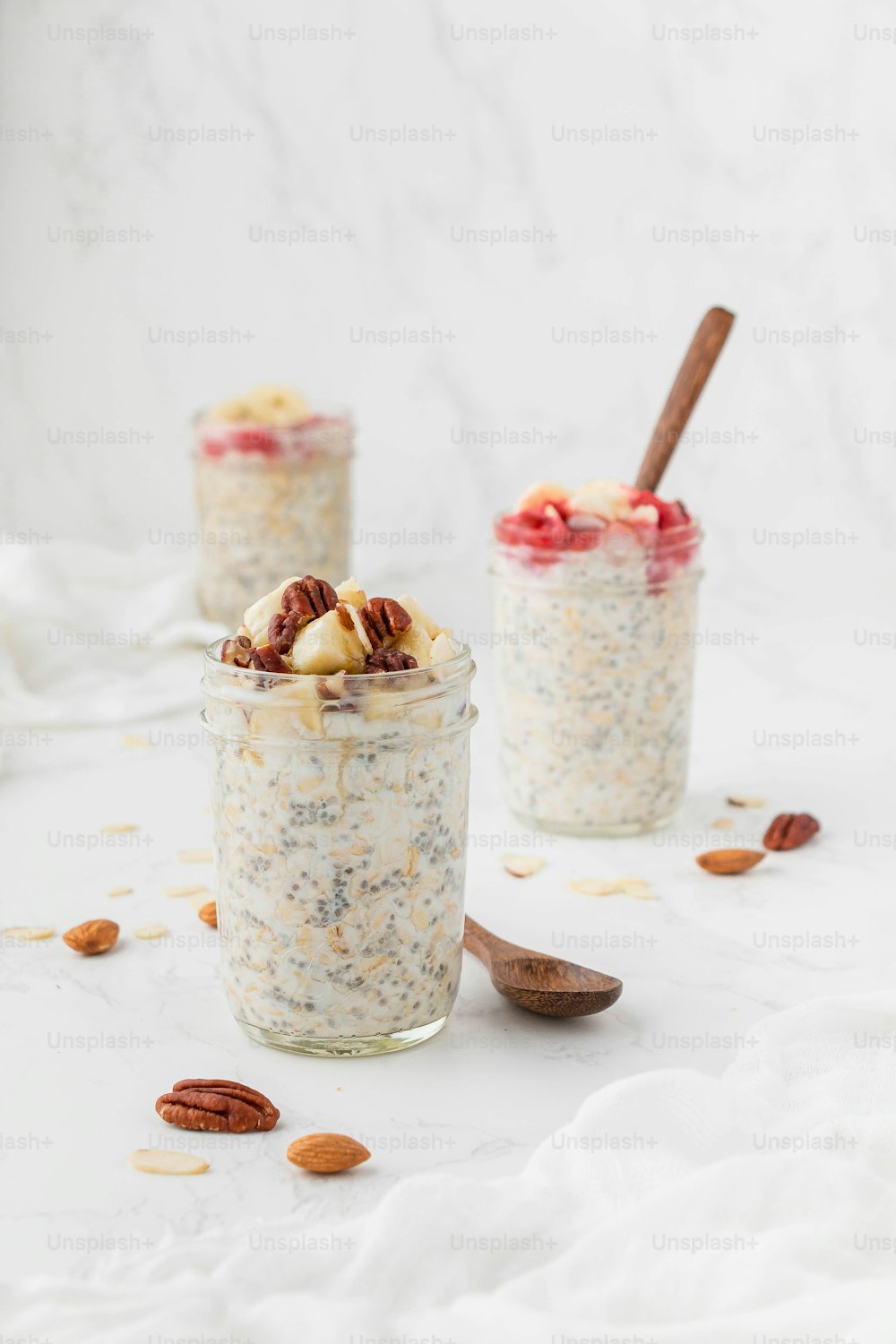 a couple of jars filled with oatmeal and nuts