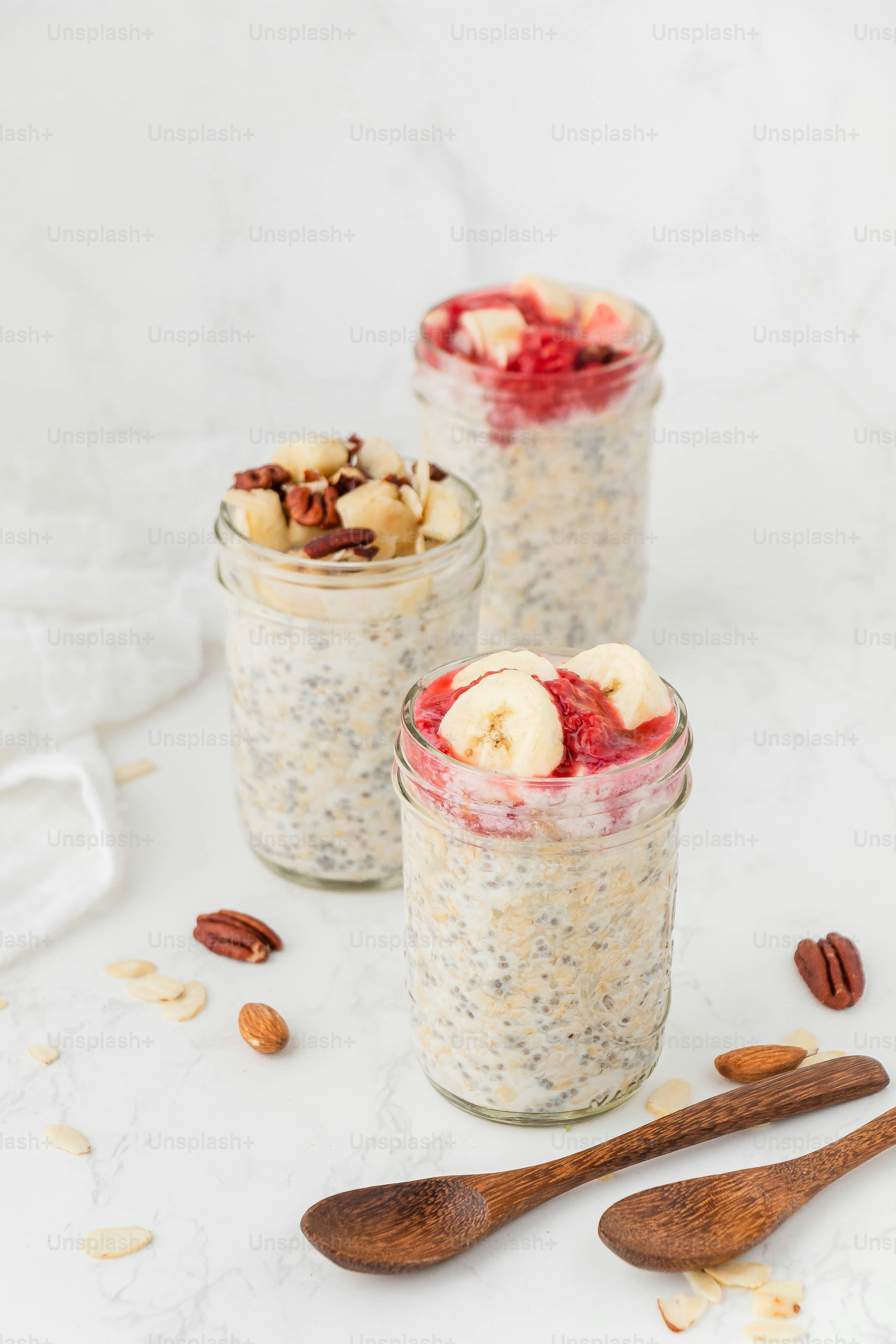 a couple of jars filled with food on top of a table