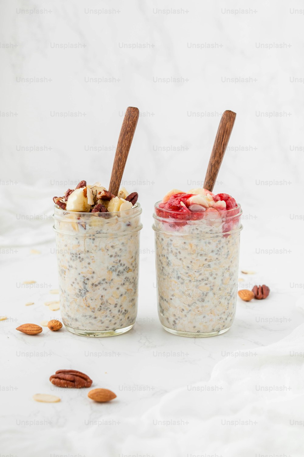 two jars filled with oatmeal and nuts