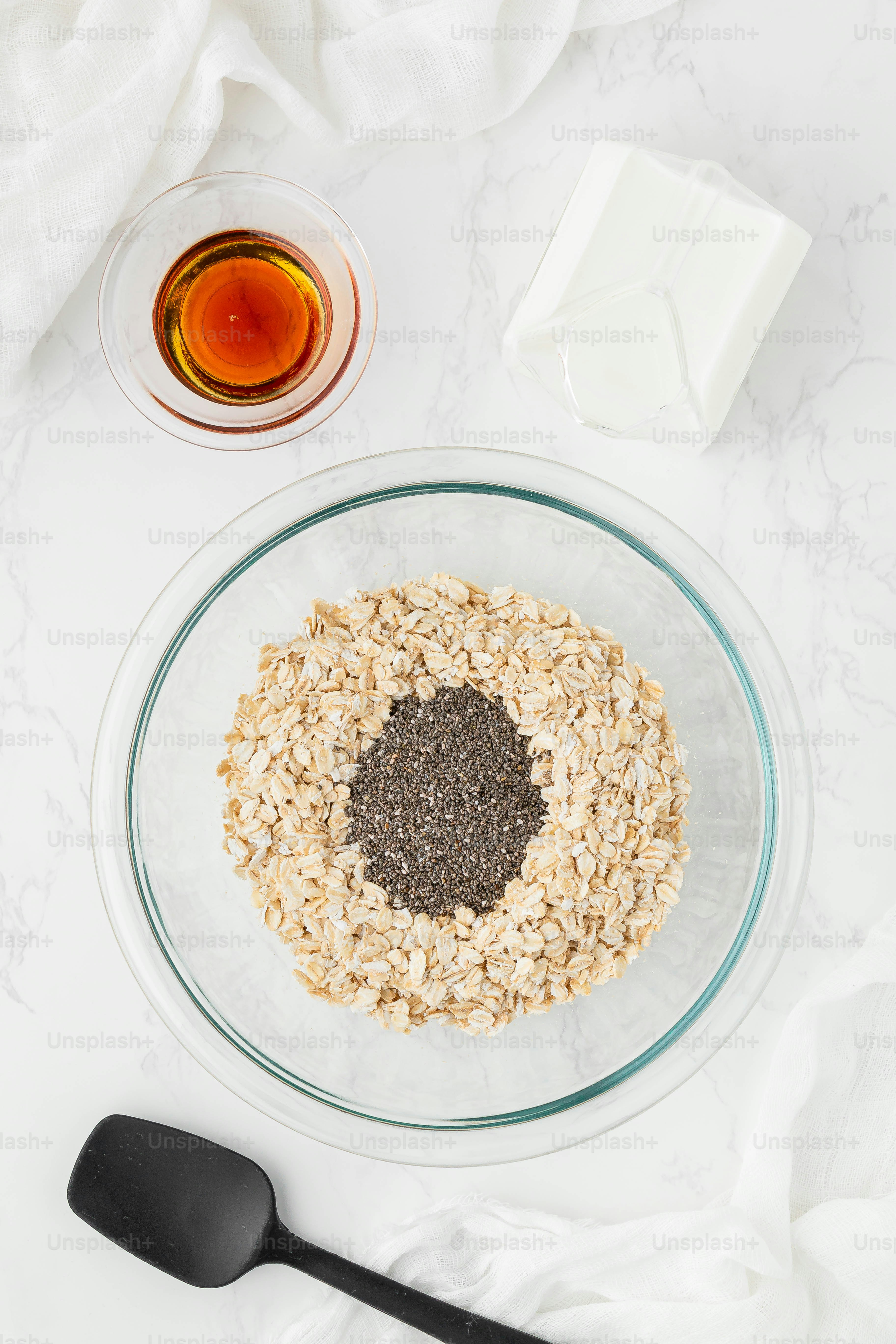 a bowl of oatmeal and a spoon on a table