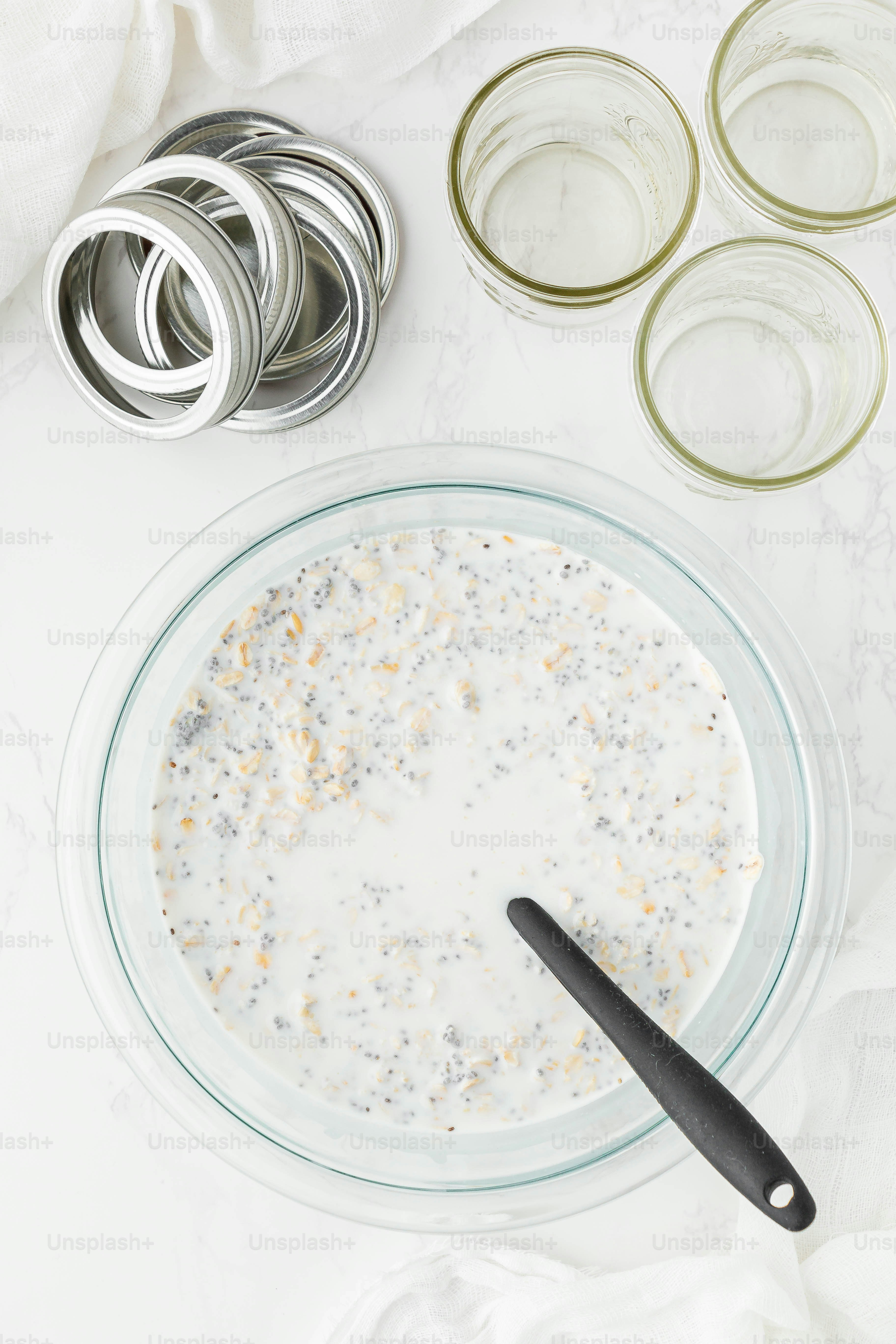 a bowl of oatmeal with a spoon next to it