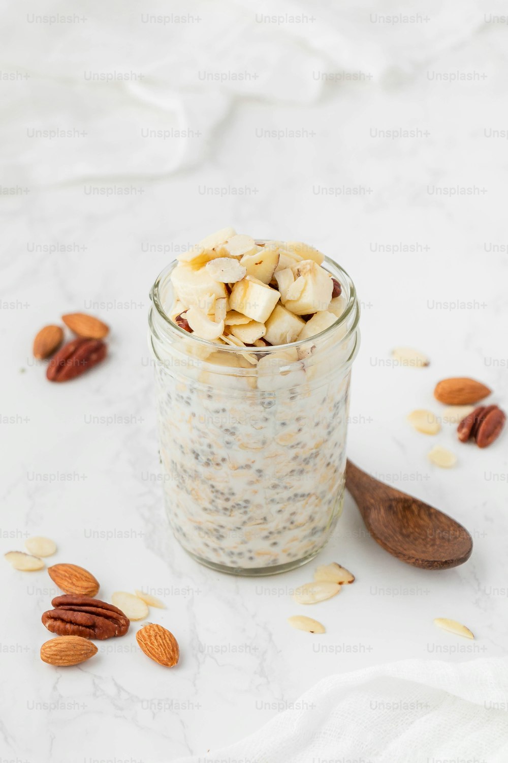 a glass jar filled with oatmeal and nuts