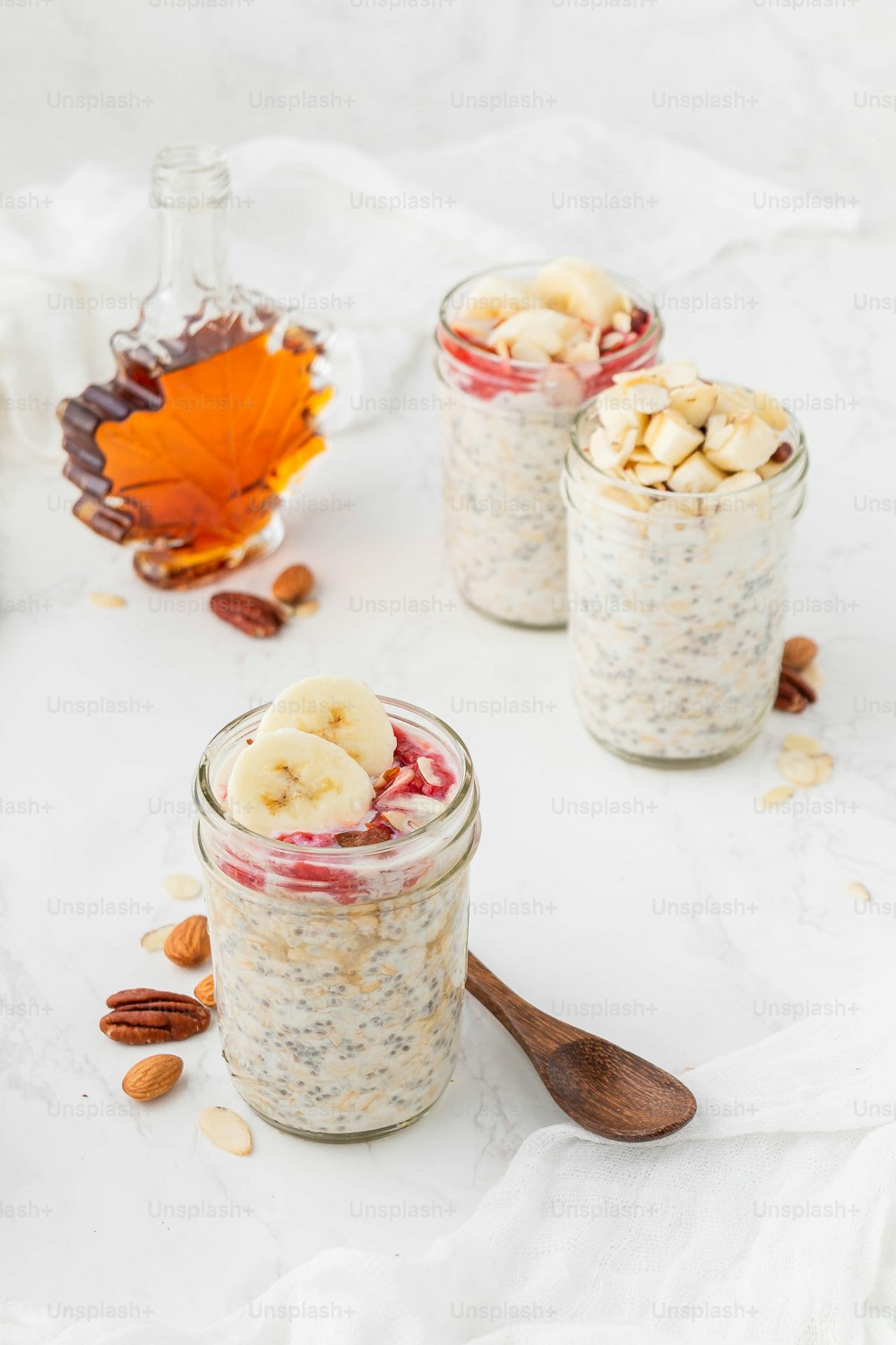 a couple of jars filled with oatmeal and bananas
