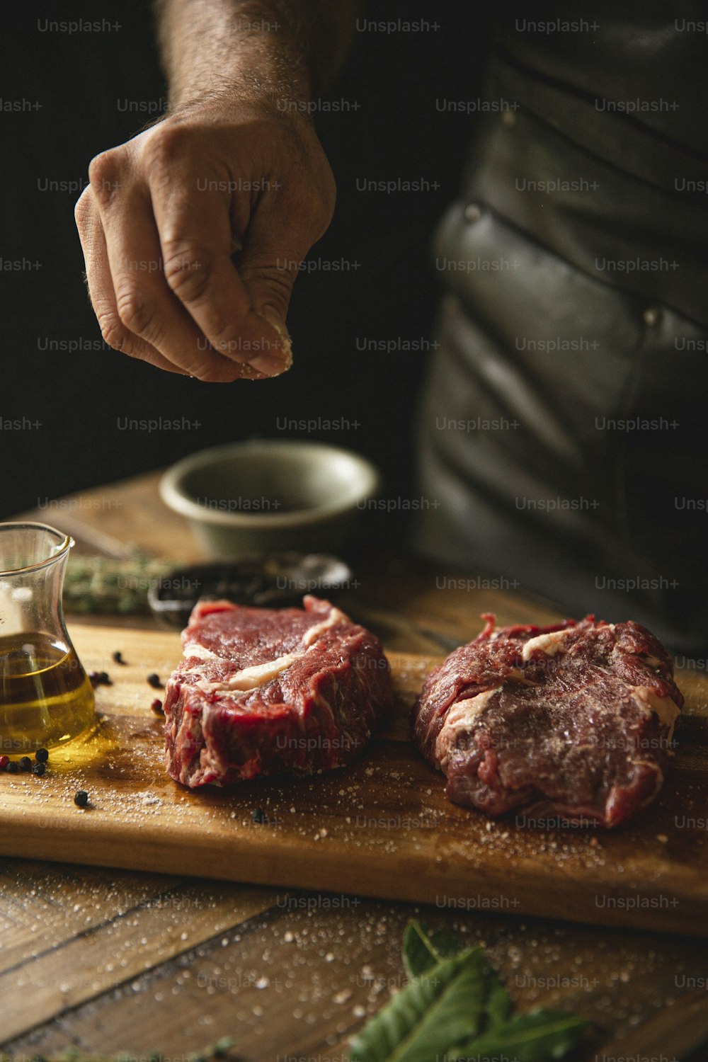 a person preparing food on a cutting board