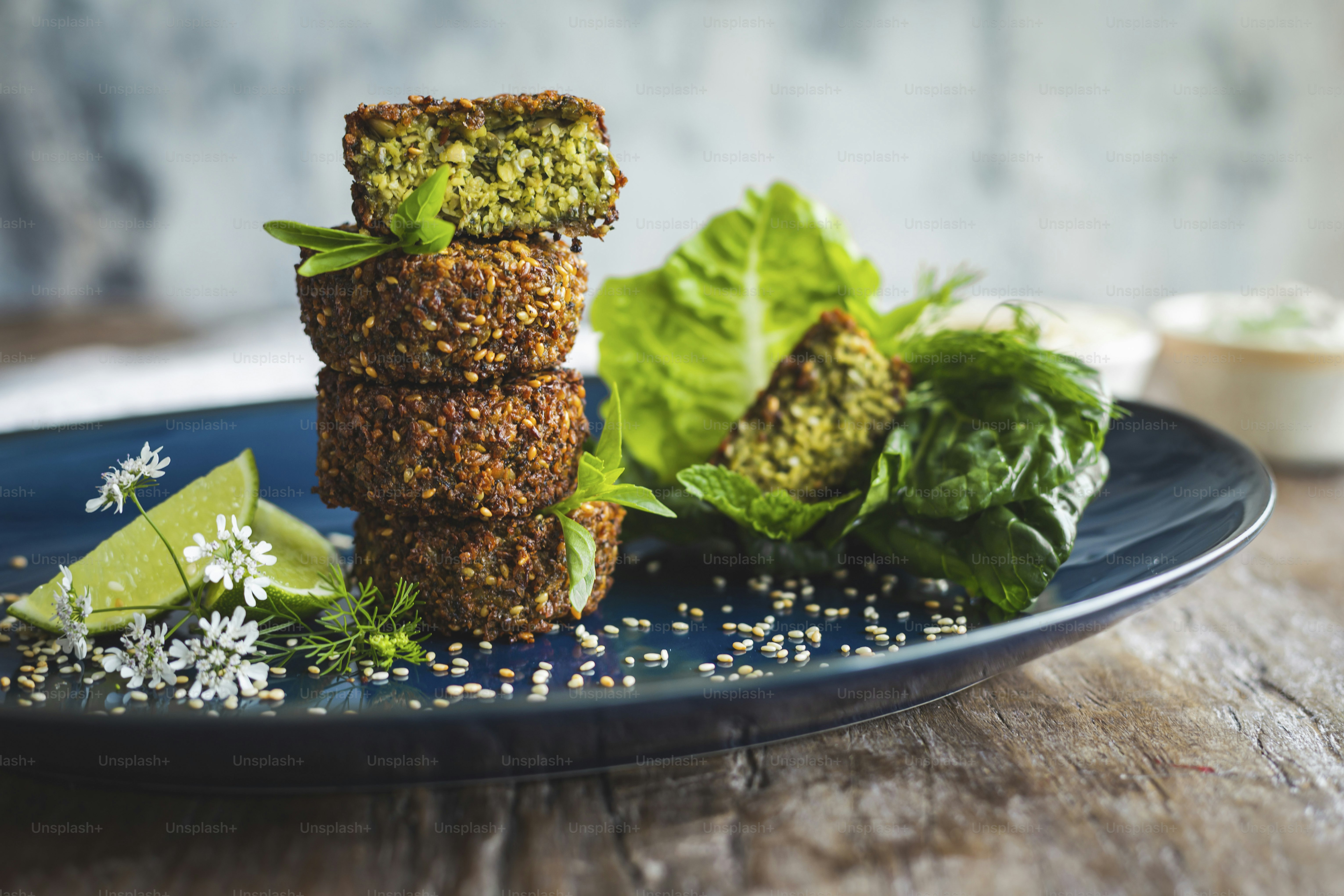 a blue plate topped with food on top of a wooden table