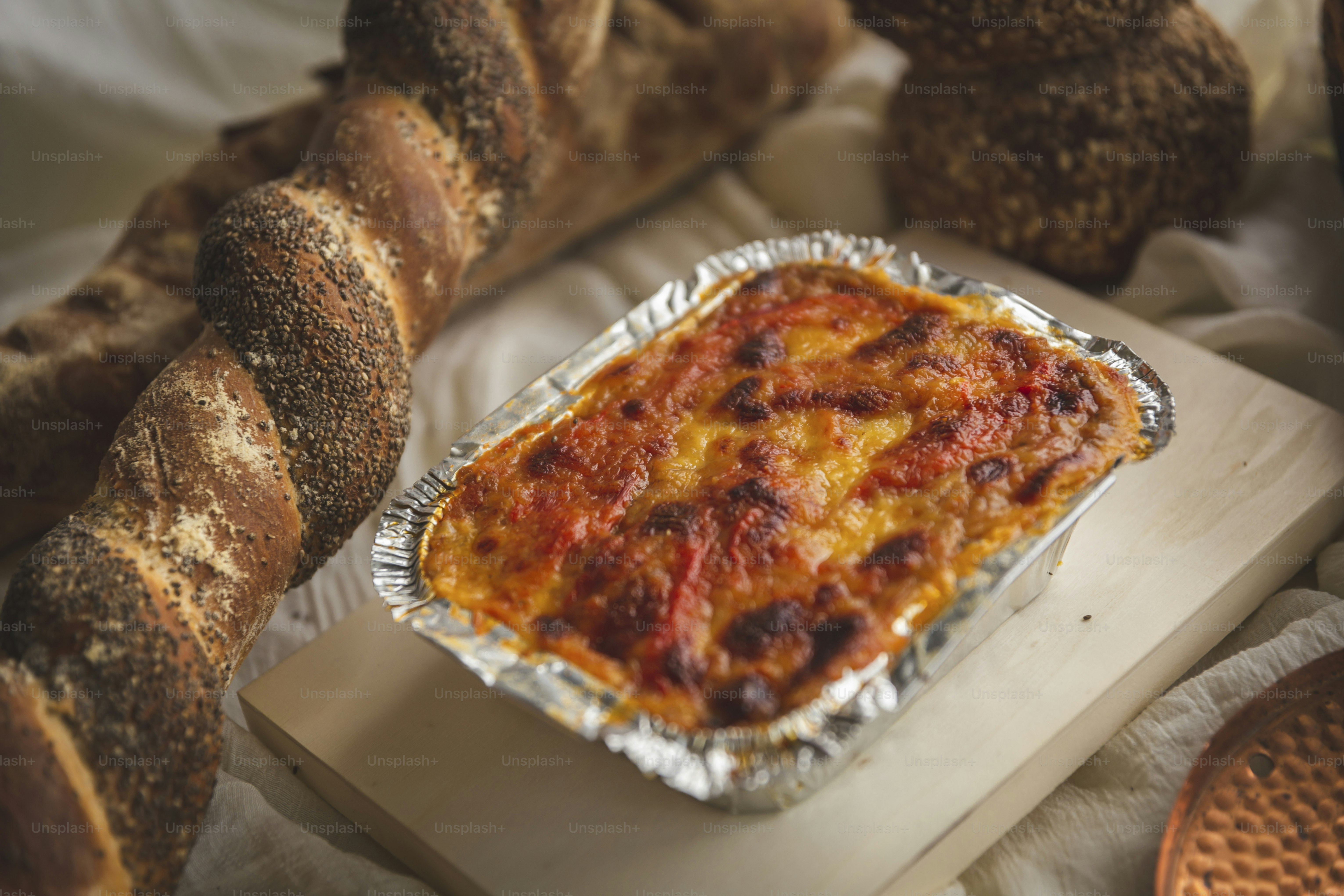 a casserole in a metal pan on a cutting board