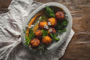 a bowl filled with food on top of a wooden table