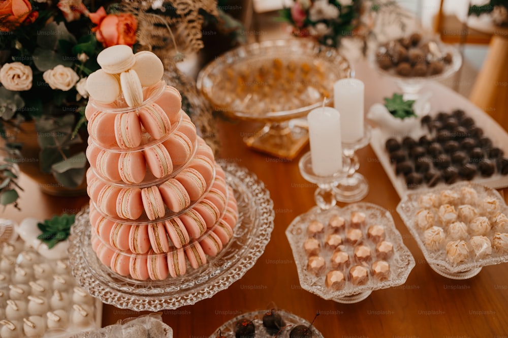 a table topped with lots of desserts and pastries