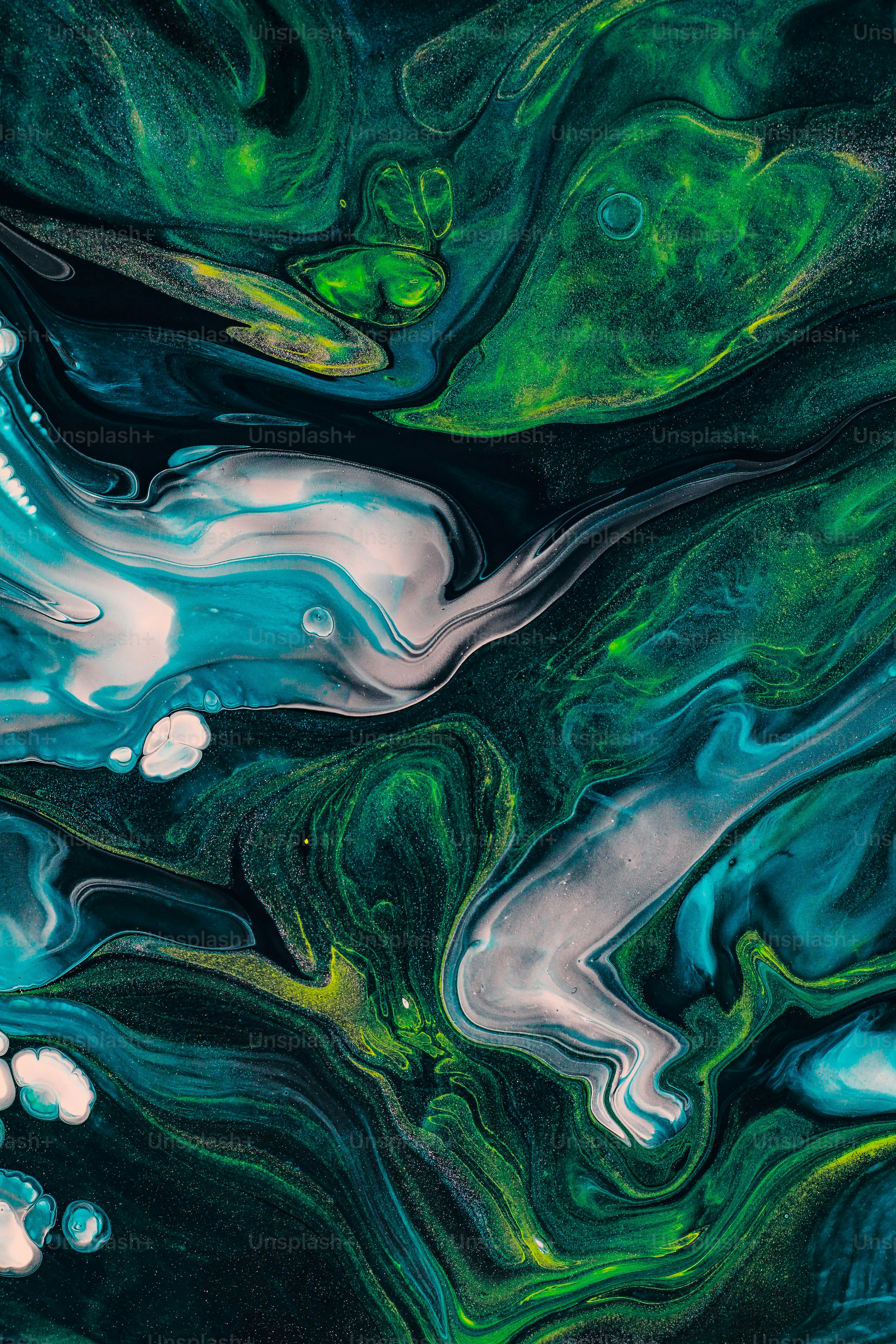 an abstract painting of green and blue colors