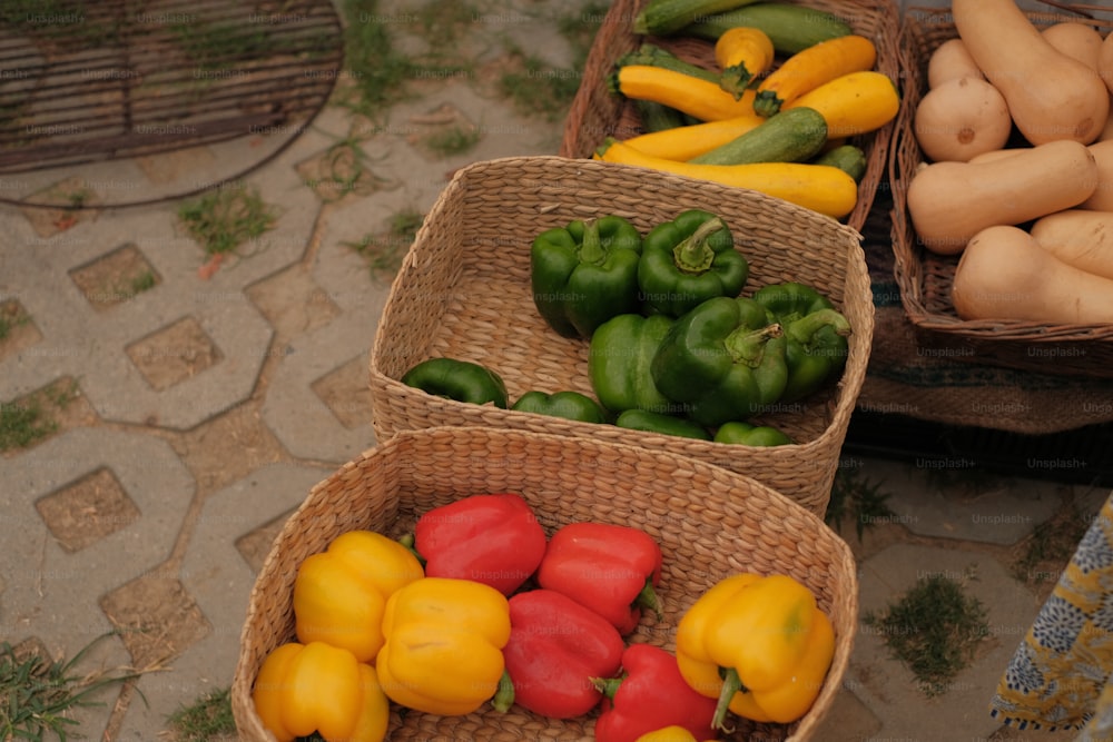 baskets filled with different types of vegetables on a table