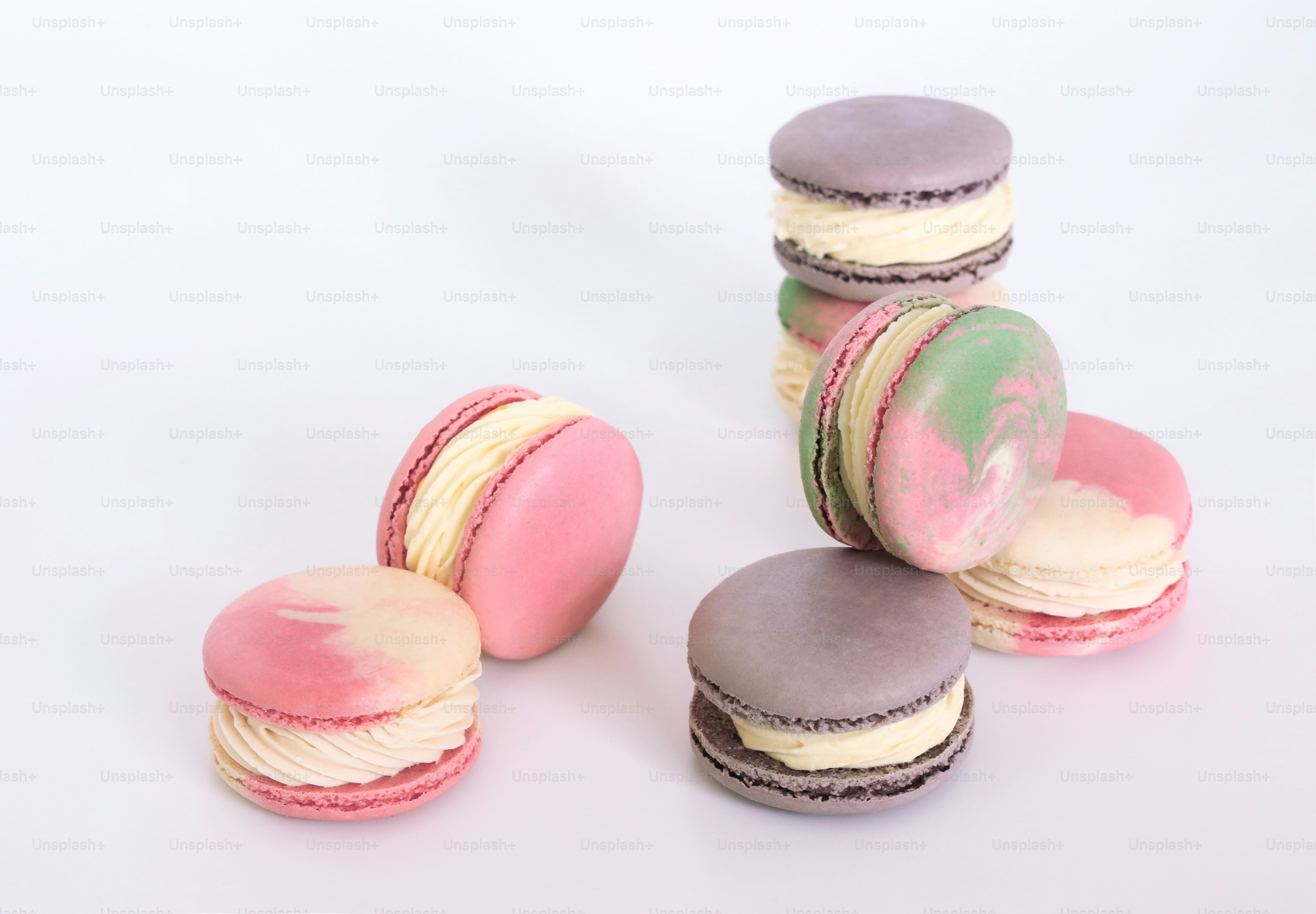 A group of macaroons sitting on top of each other photo – Dessert Image ...