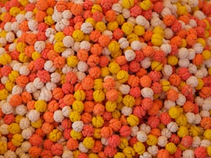 a close up of a bunch of different colored balls