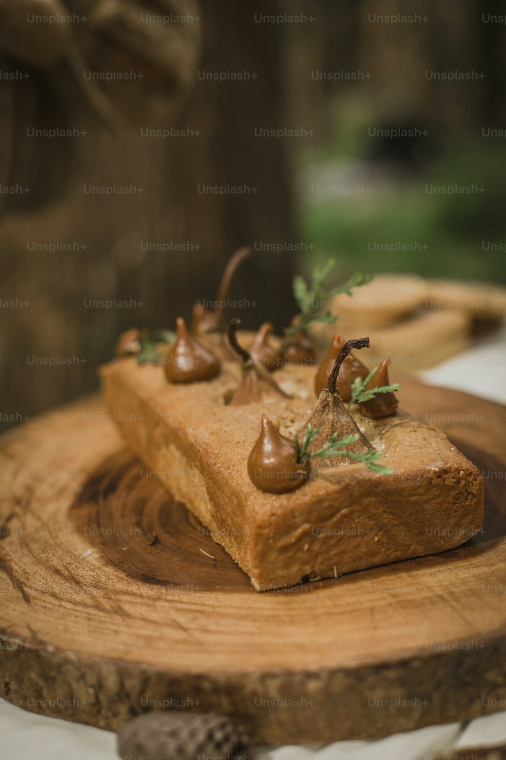 a piece of cake sitting on top of a wooden plate