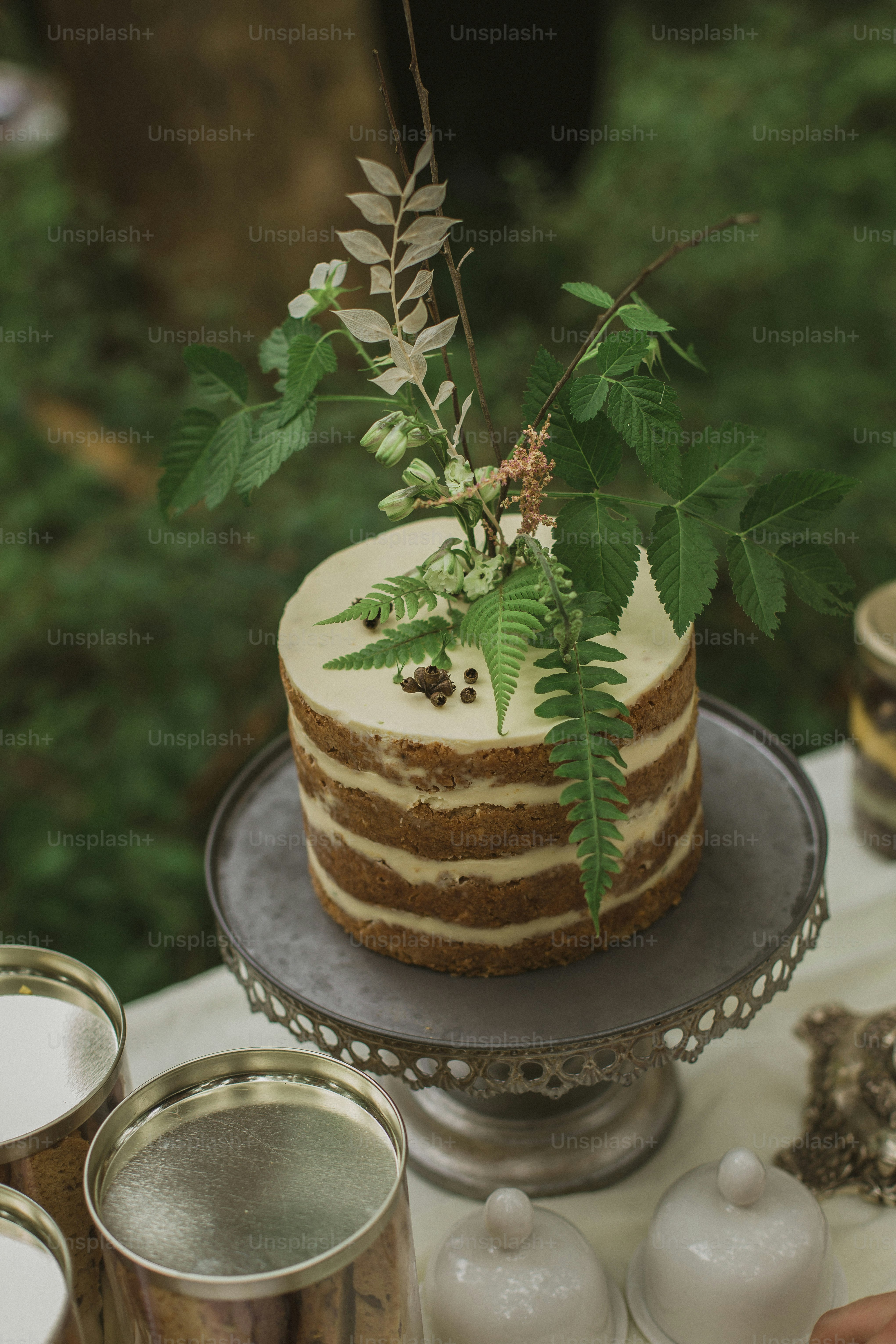 a cake sitting on top of a metal cake plate