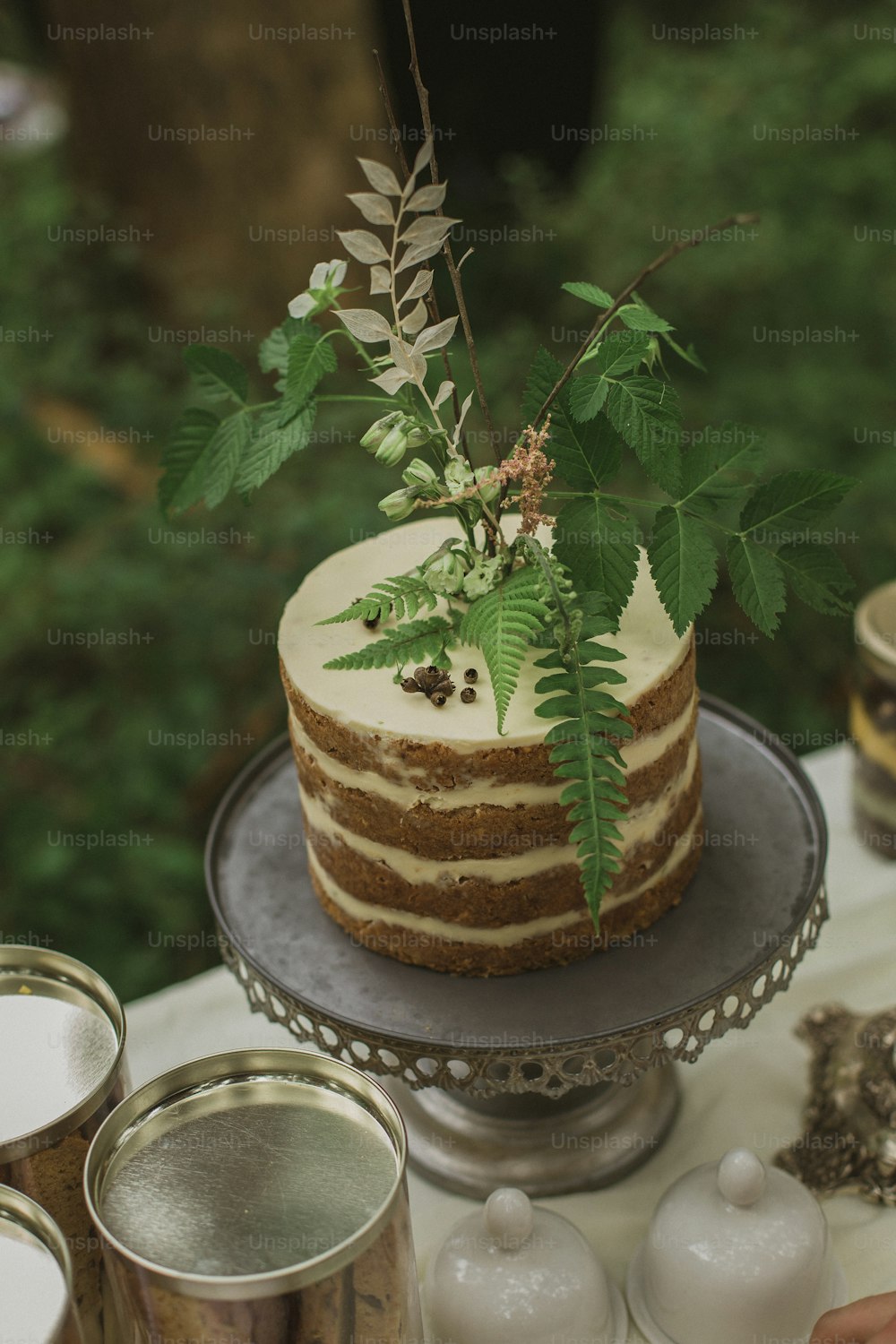 a cake sitting on top of a metal cake plate