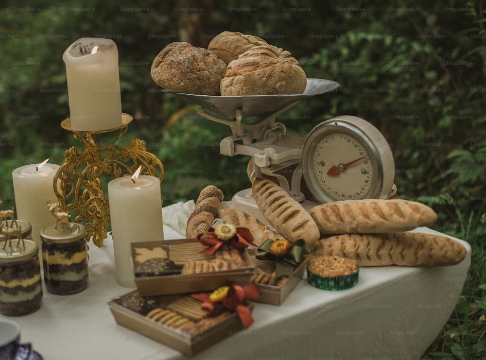 a table topped with lots of food and candles