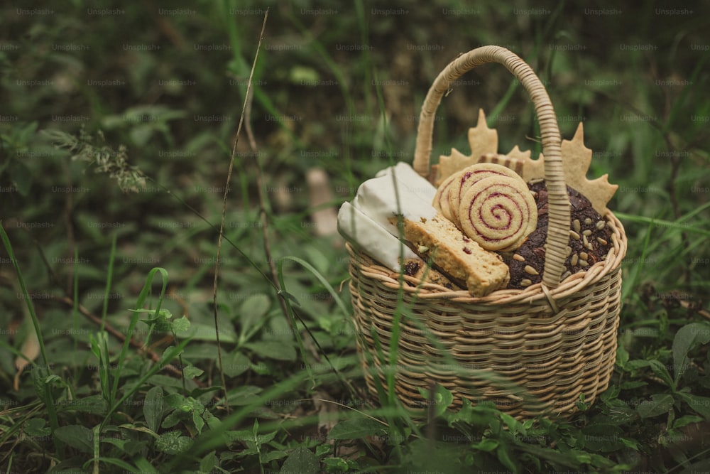 a wicker basket filled with cookies and candies