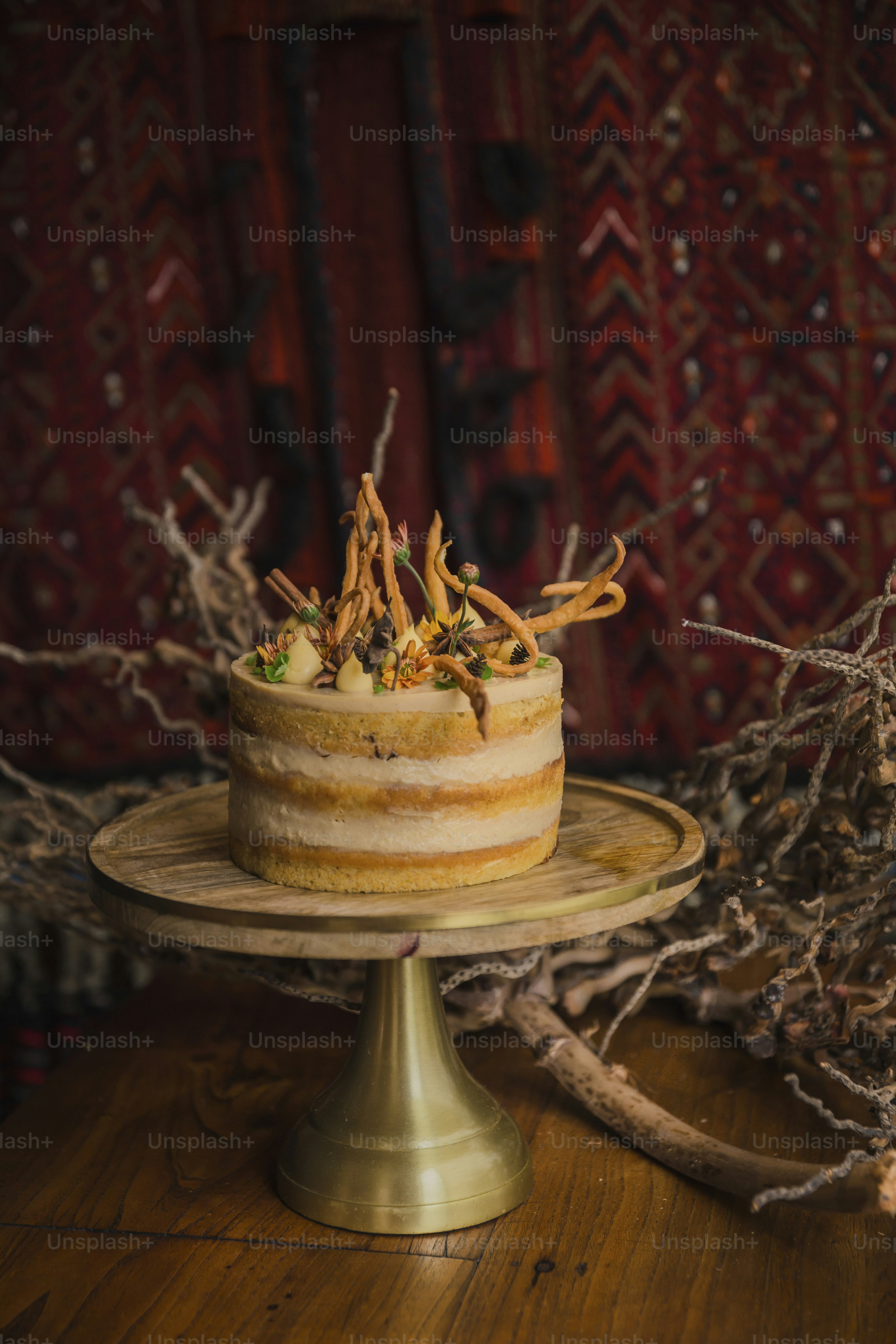 A cake sitting on top of a wooden table photo – Food presentation Image ...