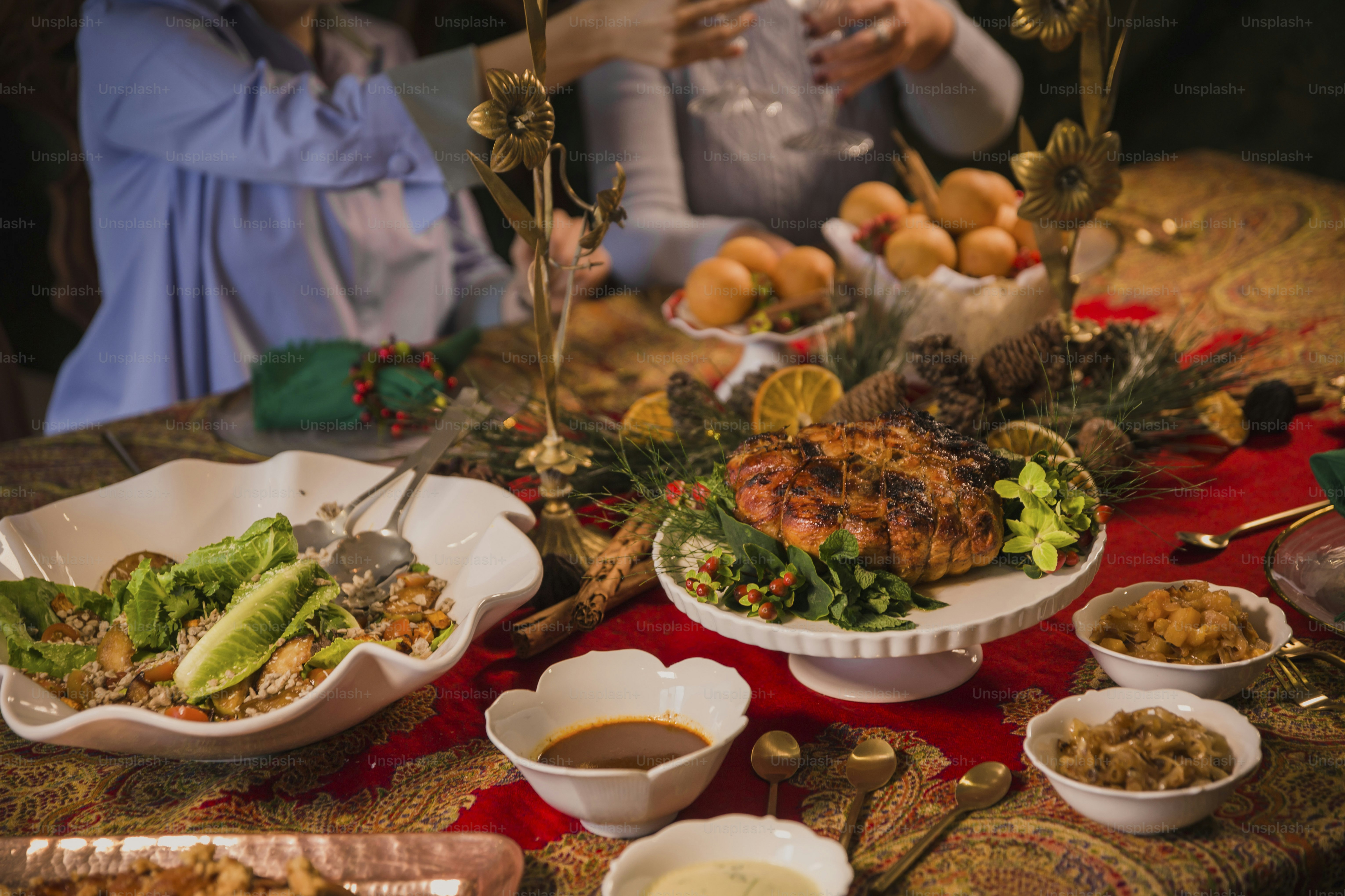 a table topped with plates of food and bowls of food