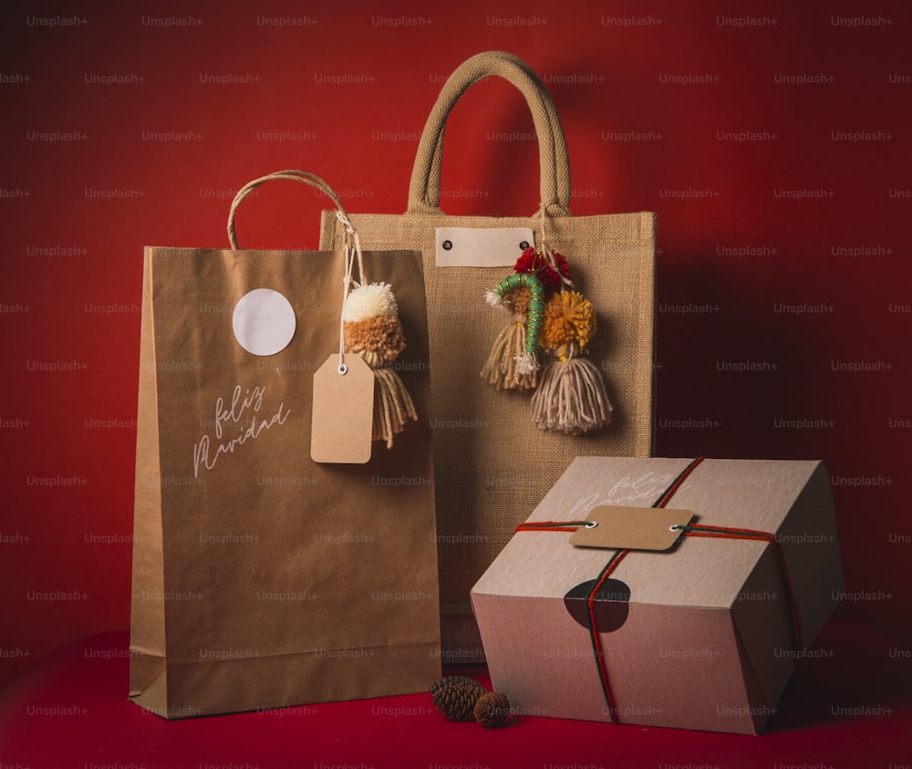 a brown paper bag and a brown gift bag