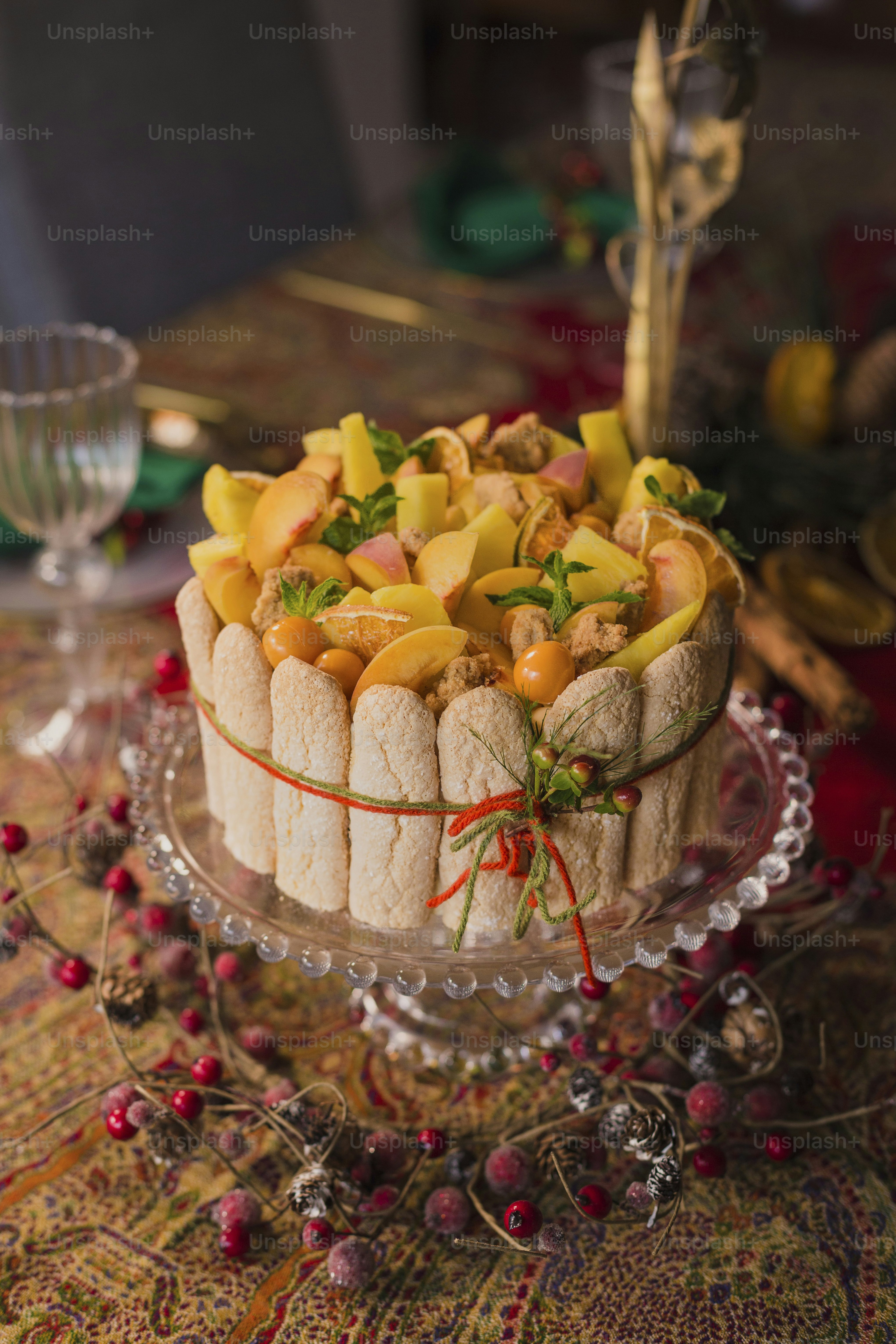a cake with fruit on top of it on a table