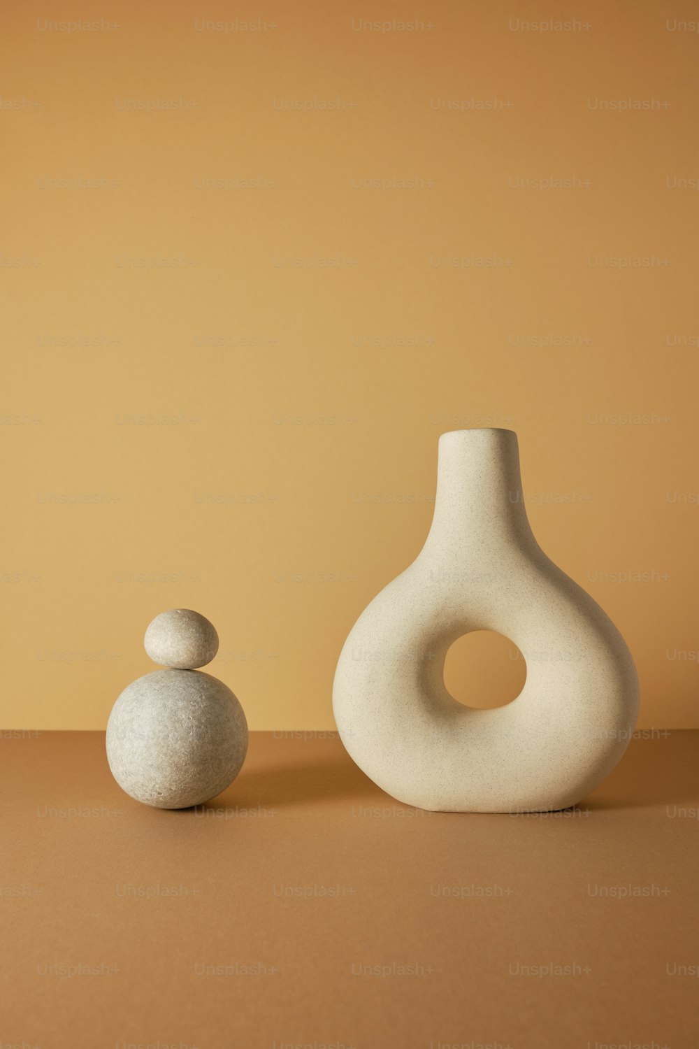 a couple of white vases sitting on top of a table