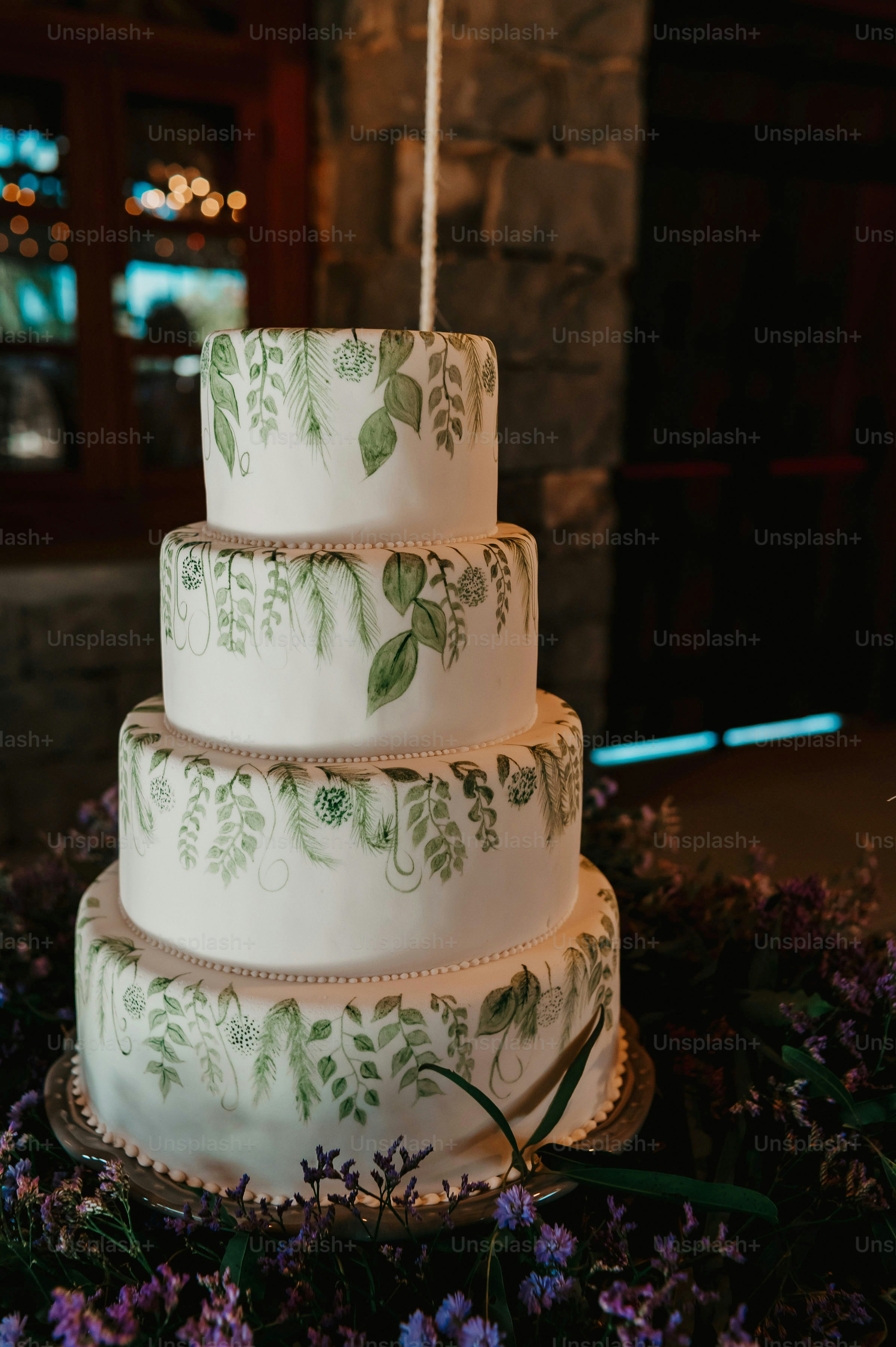 Wedding cake with green leaves | Honestweddingadvice.com