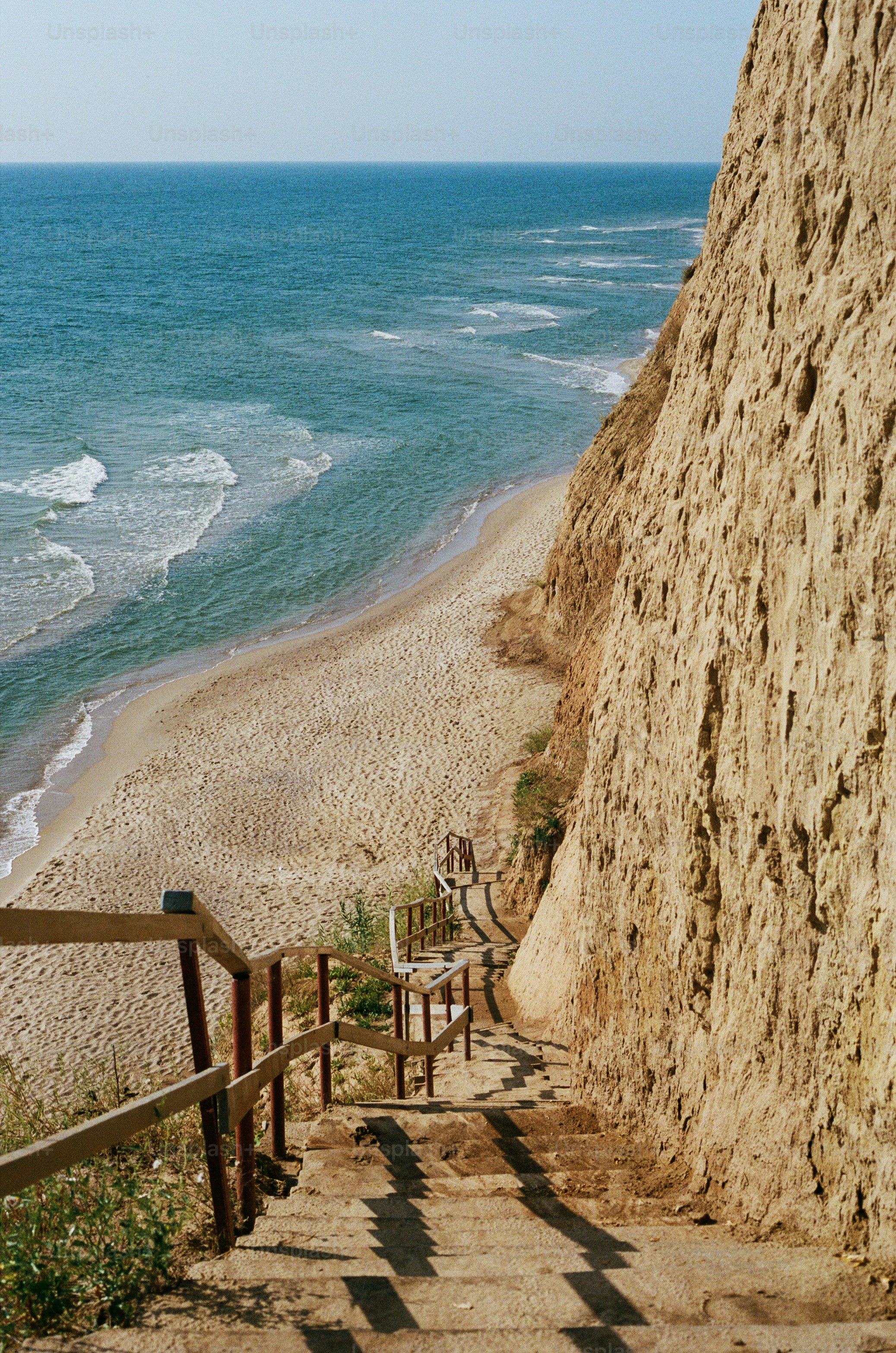 a set of stairs leading down to the beach
