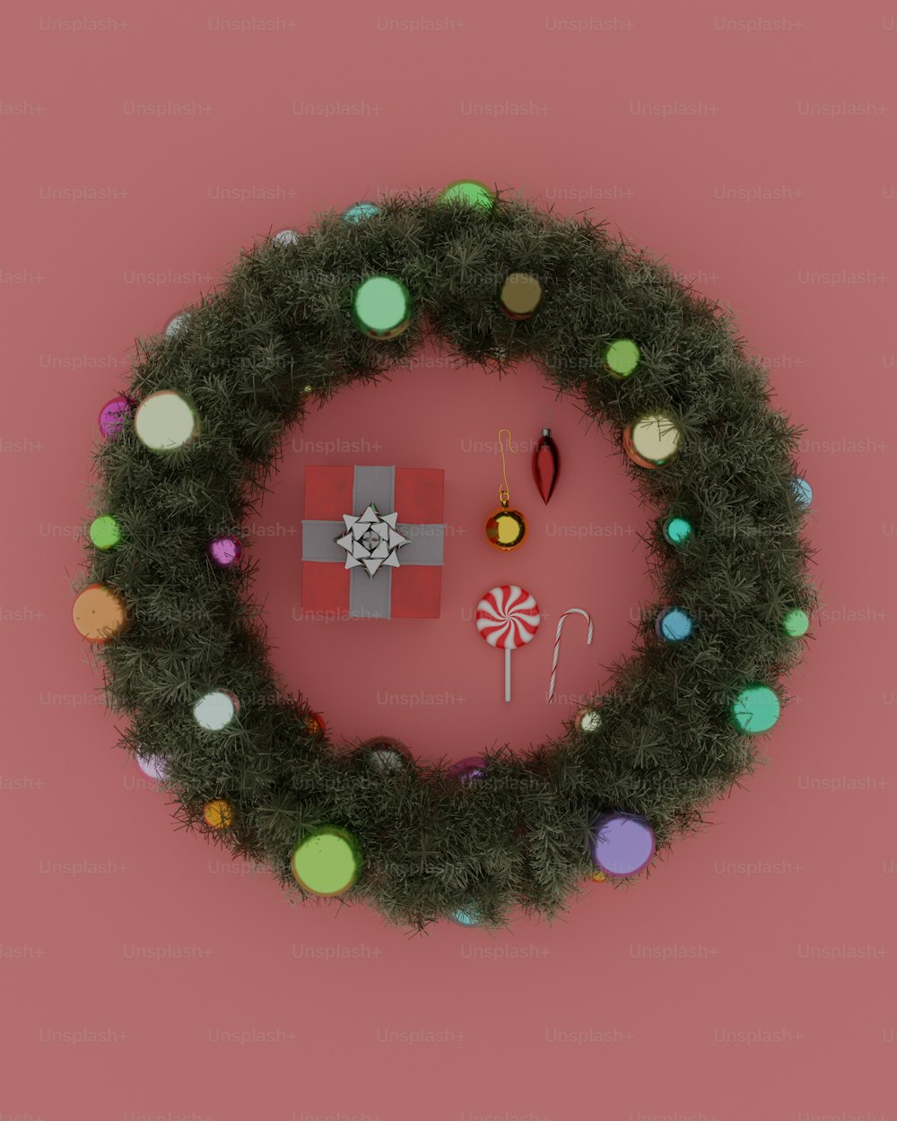 a christmas wreath with a candy cane on a pink background