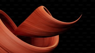a close up of a curved object on a black background