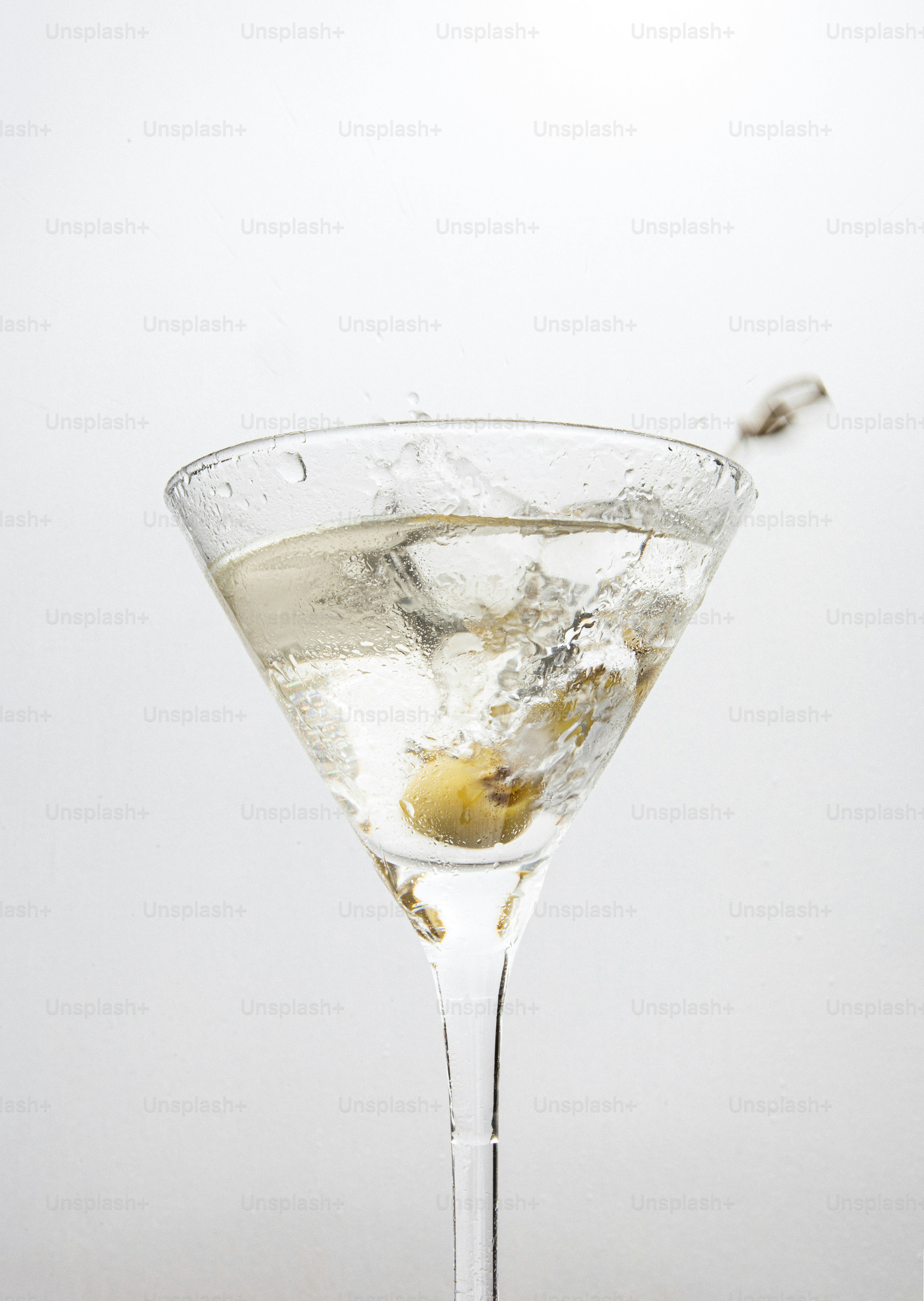 a martini glass filled with a martini drink