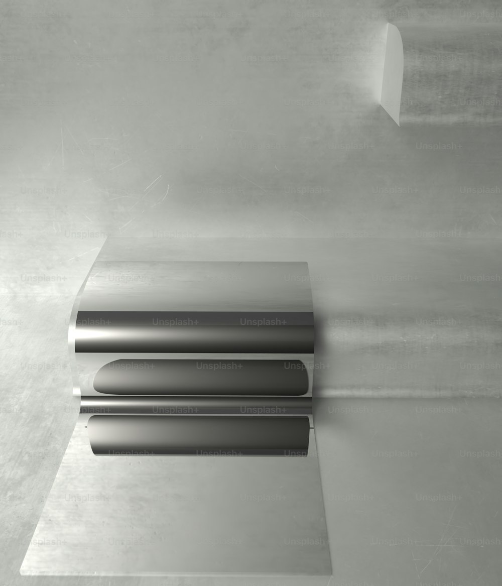 a metal object on a white surface in a room