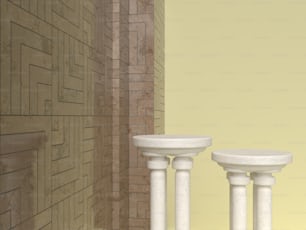 Un par de pedestales blancos sentados junto a una pared