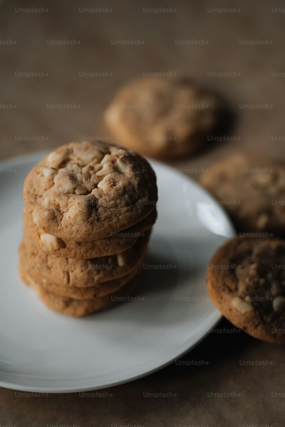 a stack of cookies sitting on top of a white plate