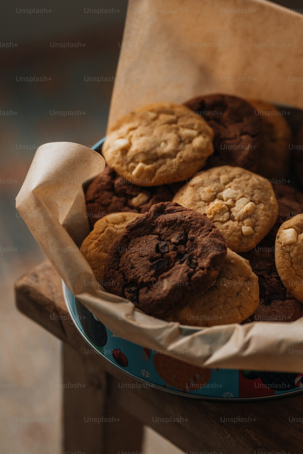 a basket of cookies sitting on top of a wooden table