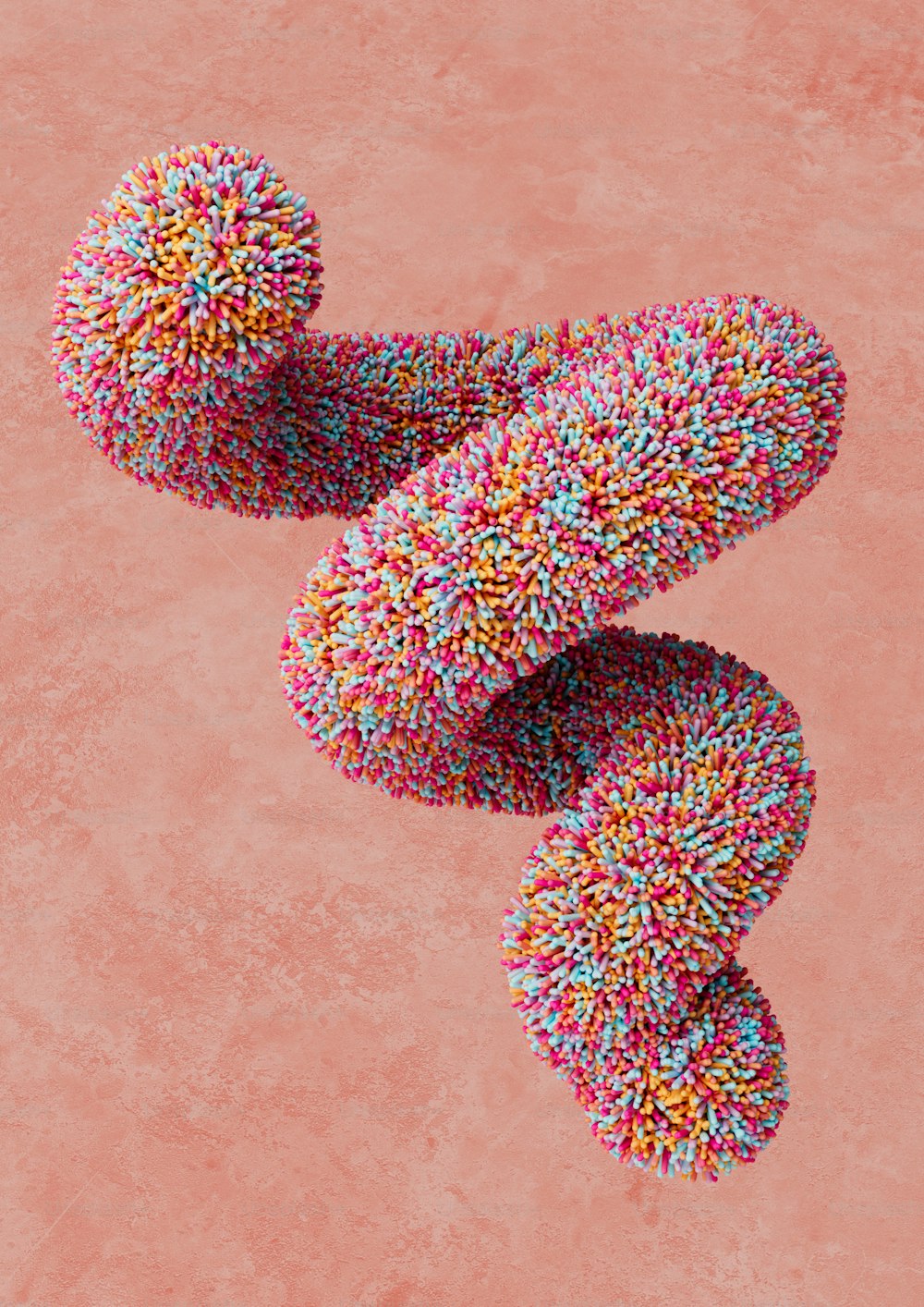 a group of sprinkled donuts on a pink background