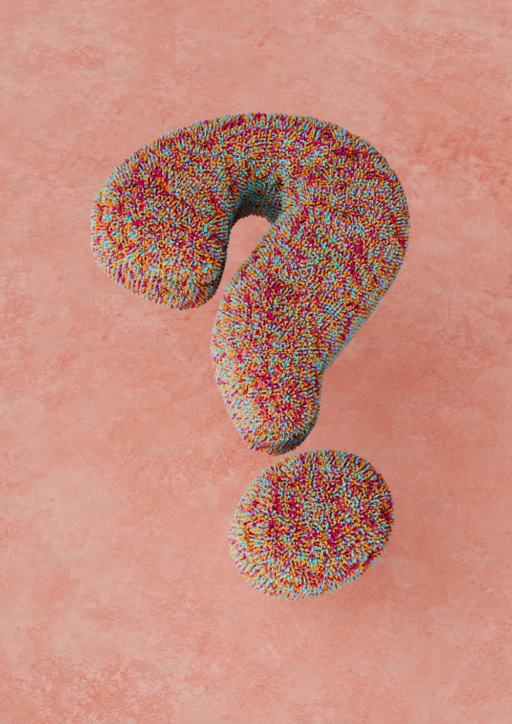 a donut with sprinkles on a pink background