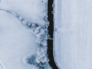 an aerial view of a snow covered field