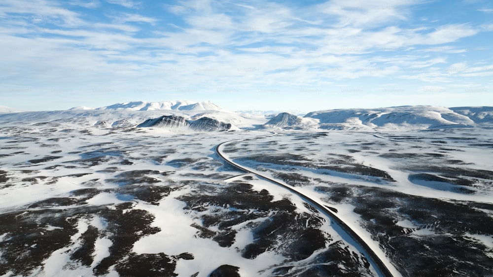 an aerial view of a snow covered mountain range