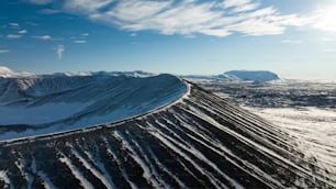 an aerial view of a snow covered mountain