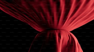 un panno rosso drappeggiato su uno sfondo nero