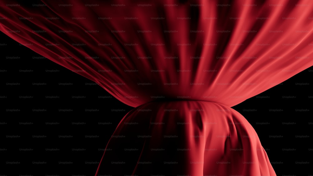 a red cloth draped over a black background