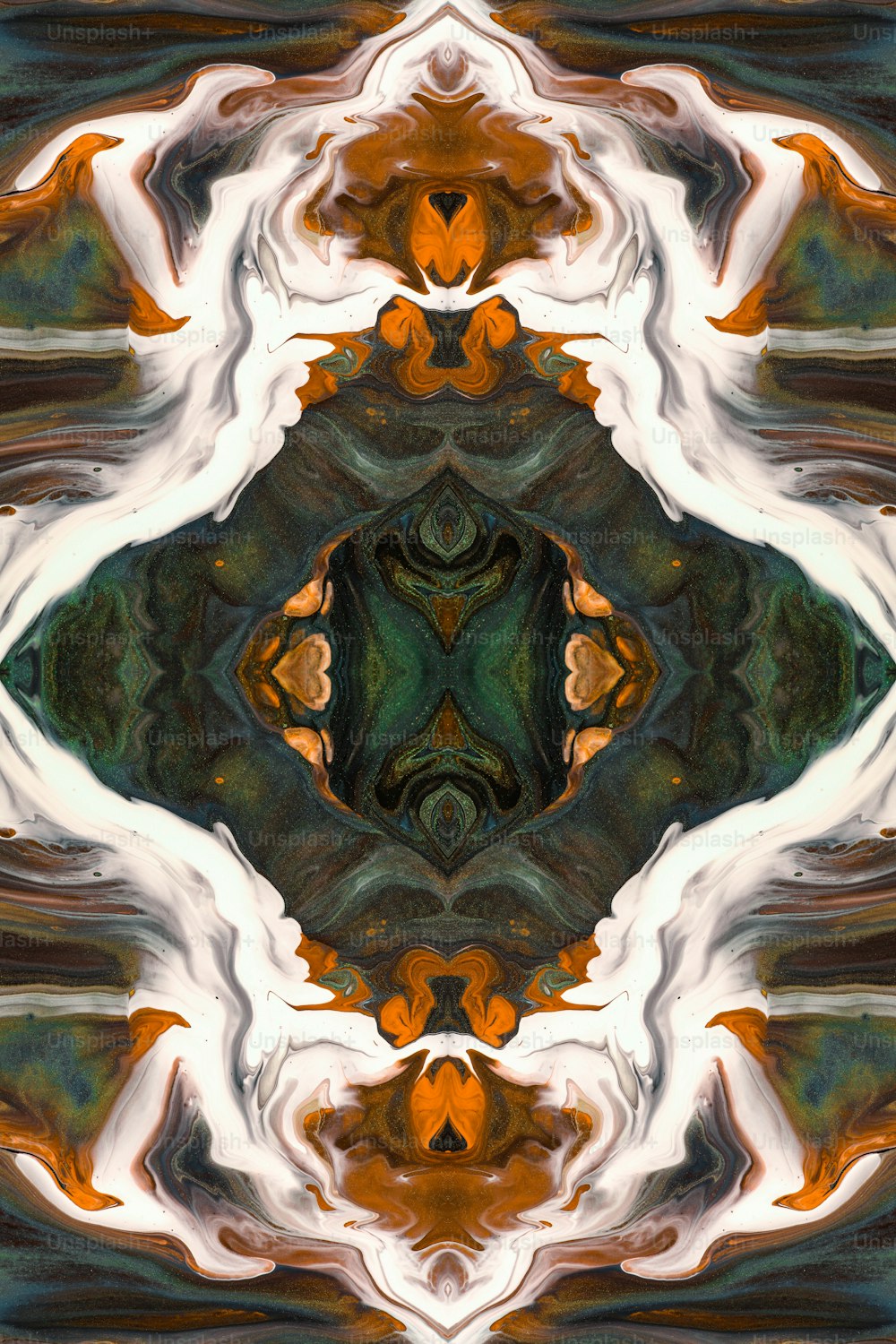 an abstract image of a green and orange flower